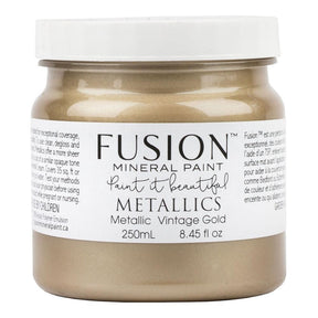250mL jar of Fusion Mineral Paint in Vintage Gold with mica pigments, white lid, and branded label.