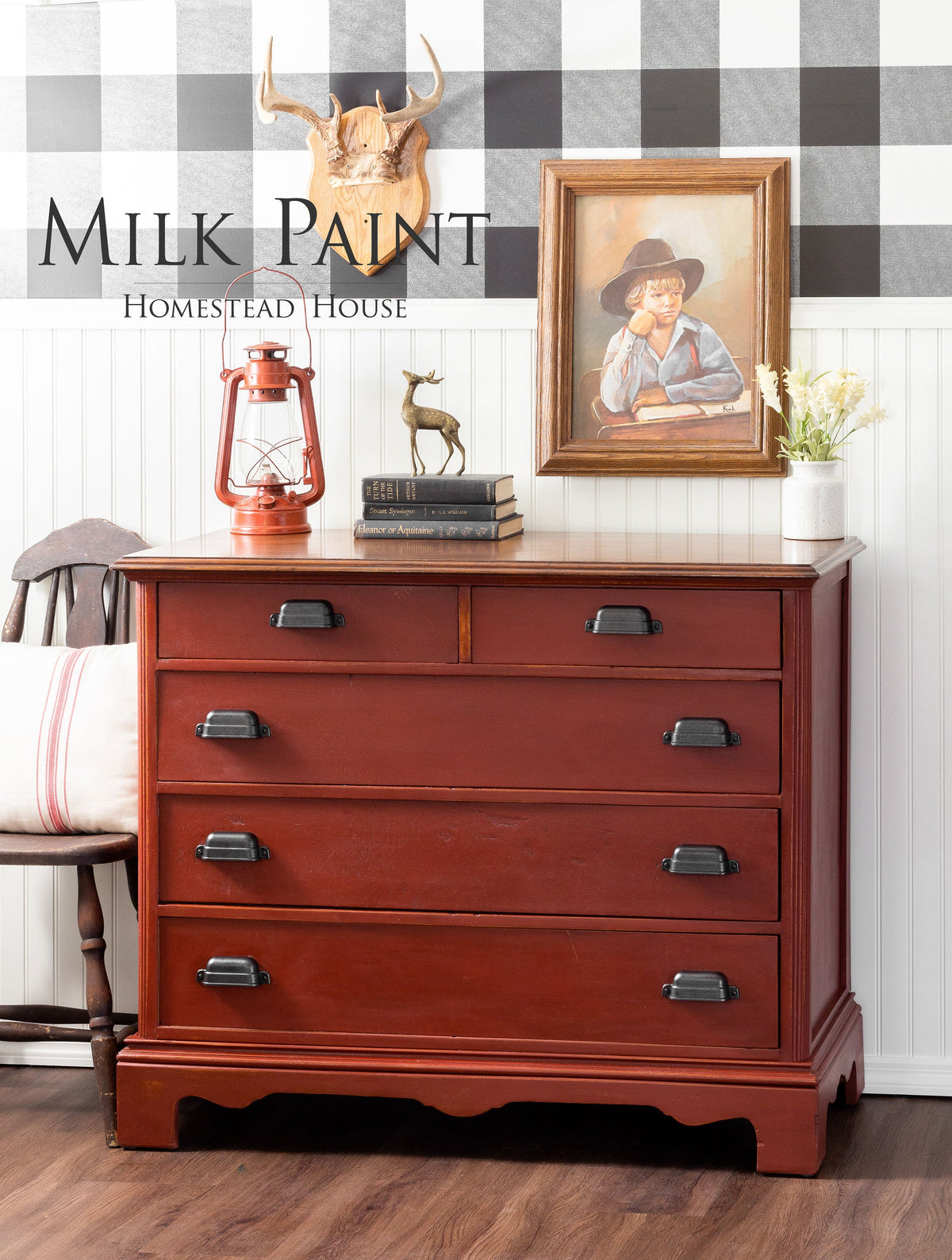 Red dresser with black handles, painted in Homestead House Voyageur Milk Paint.