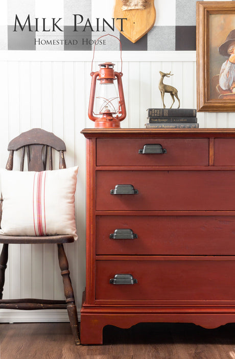Bold red dresser in Homestead House Voyageur Milk Paint with black handles.