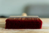 Staalmeester Wall Brush Series 2910 with thick red bristles on wood, for water-based paint.