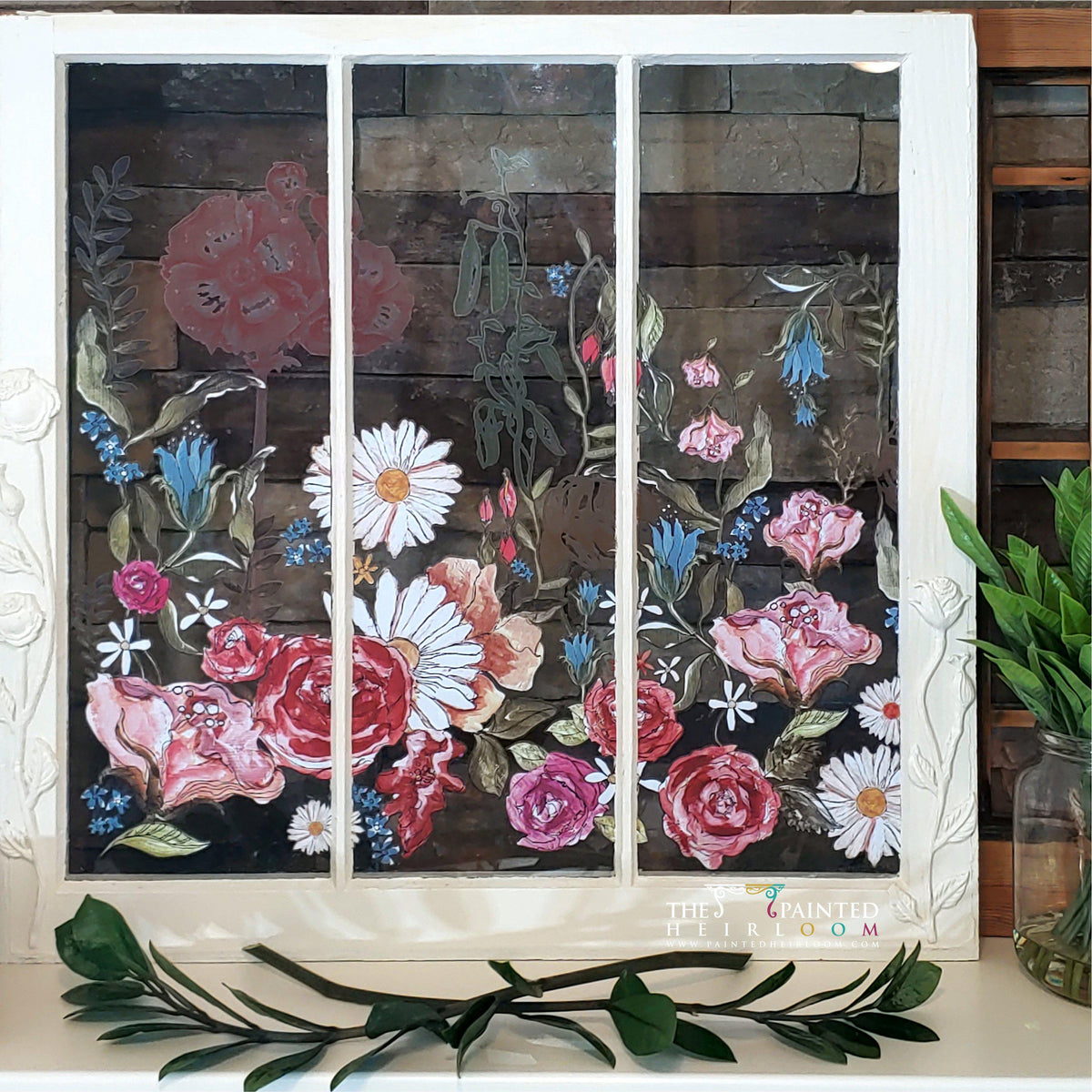 I.O.D. Wander Decor Transfer floral art by Iron Orchid Designs, framed on a mirror and set on a wooden shelf.