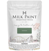 330 g bag of Homestead House Waterloo Green Milk Paint with floral art and a warning label at the bottom.