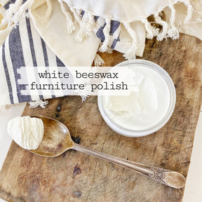 Spoon with Sweet Pickins White Beeswax Furniture Polish next to Old Fashioned Milk Paint jar and striped cloths.