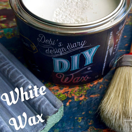Open can of DIY Paint Co. White DIY Wax with brush and wood sample; text reads “White DIY Wax.”.