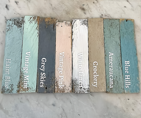 Eight wooden planks painted DIY Paint Co. White Linen Cottage Color displayed in a row.