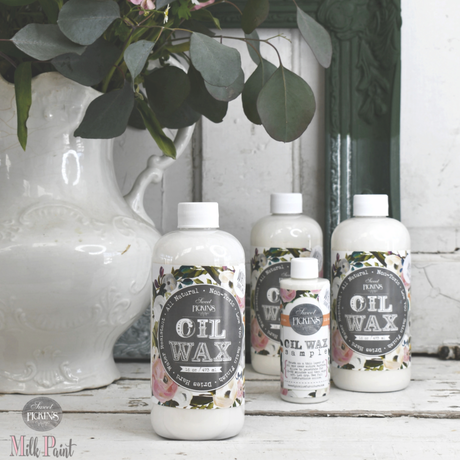 Four Old Fashioned Milk Paint White Oil Wax bottles arranged together.