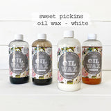 Four Sweet Pickins White Oil Wax bottles, Old Fashioned Milk Paint, with labeled bottle featured front and center.