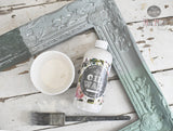 White Oil Wax by Sweet Pickins with brush, shown on rustic table; brand: Old Fashioned Milk Paint.