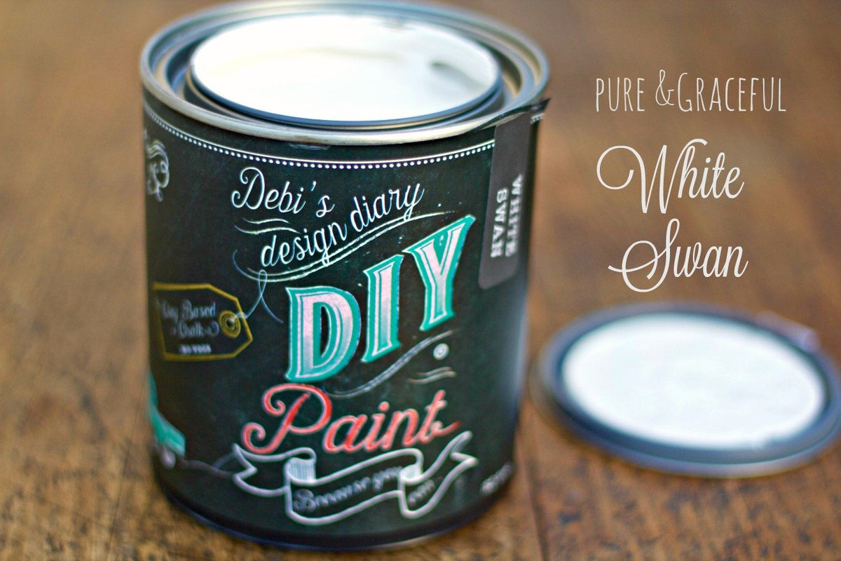 Open can of DIY Paint Co. White Swan DIY Paint placed on a wooden surface.