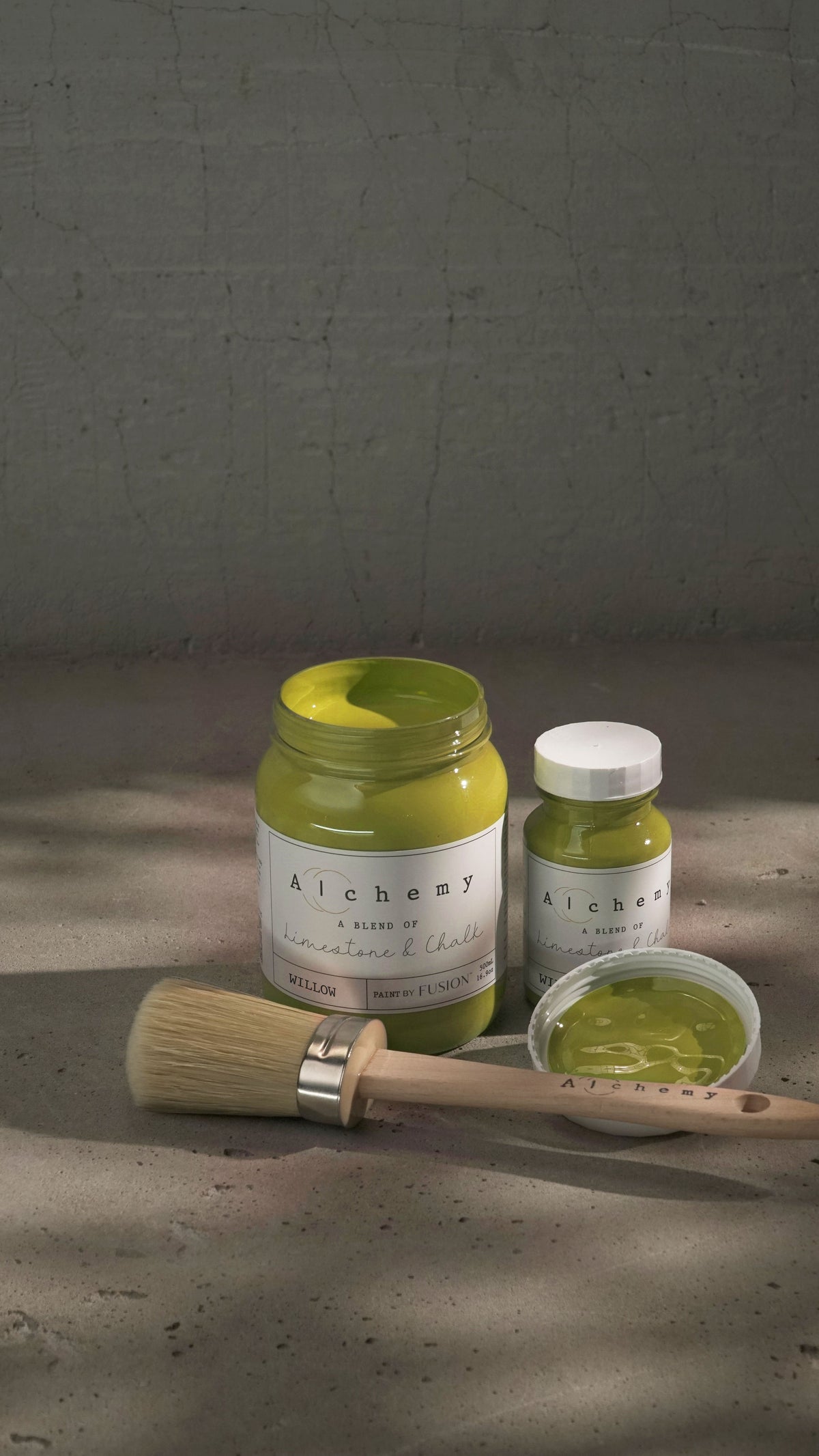 Open and closed Willow Alchemy Paint by Fusion Mineral Paint with paintbrush and dish of chalk-style paint.