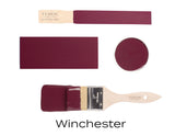 Fusion Mineral Paint Winchester burgundy can, paint swatch, and brush displayed together.
