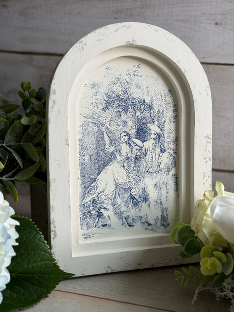 IOD Wood Gallery Blank with blue pastoral scene, green leaves, and white flowers on a cradled wood surface.