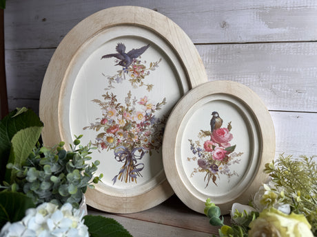 Two oval I.O.D. Wood Gallery Blanks with bird and floral designs, suitable for painting or crafts.