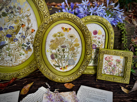 Three oval and one square I.O.D. Wood Gallery Blanks featuring florals, butterflies, and book page designs.