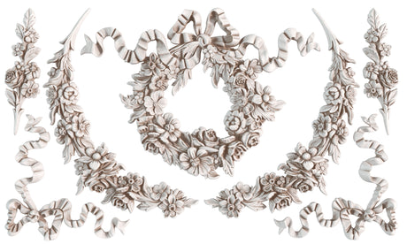 Symmetric floral and ribbon patterns formed with I.O.D. Wreath & Swags Mould for vintage-style decoration.