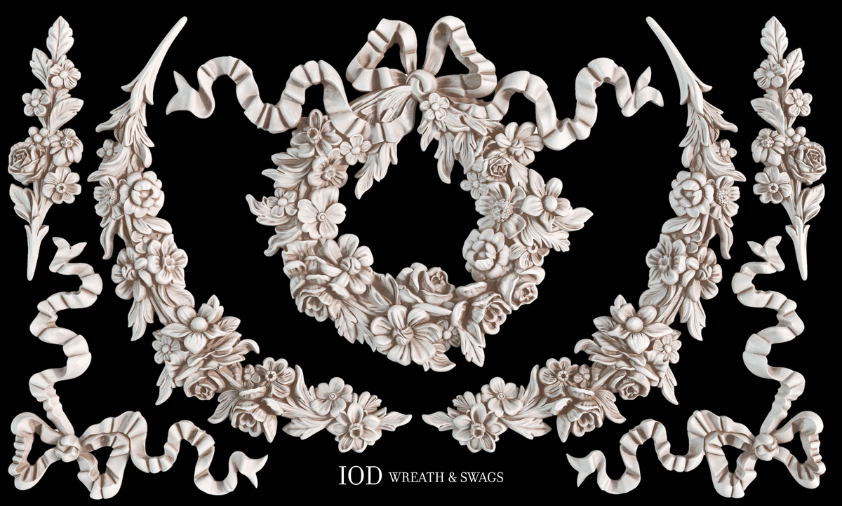 Wreath, swags, and ribbons created with I.O.D. Wreath & Swags Mould by Iron Orchid Designs on a black background.
