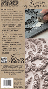 Hand pressing I.O.D. Wreath & Swags Mould onto surface with ornate floral patterns visible nearby.