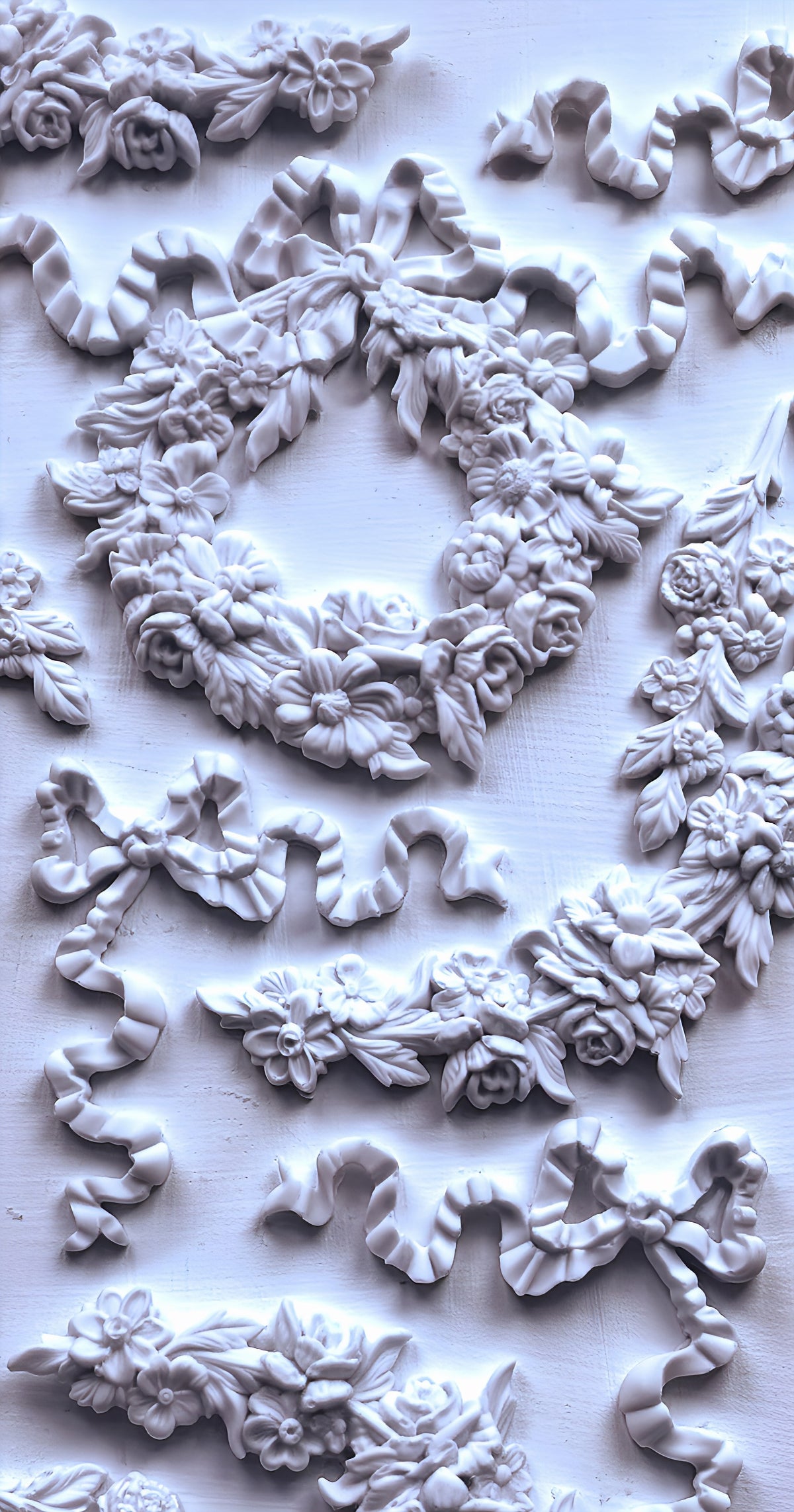 IOD Wreath & Swags Mould featuring floral and ribbon reliefs on a light background.