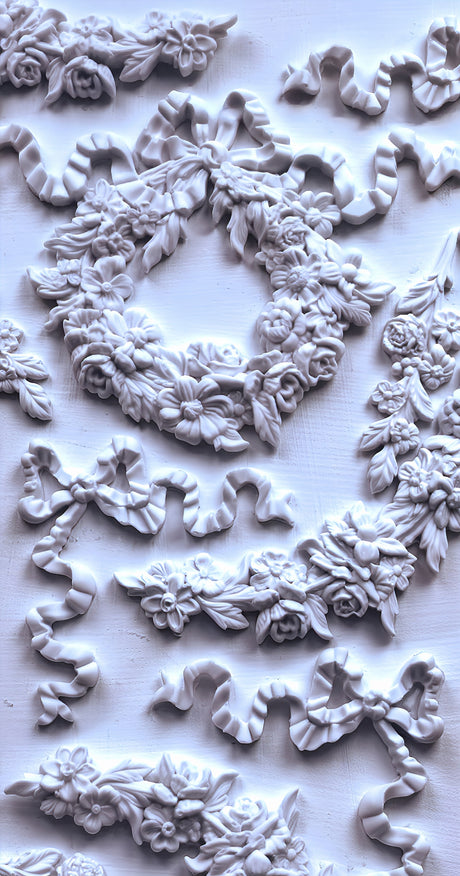 IOD Wreath & Swags Mould featuring floral and ribbon reliefs on a light background.