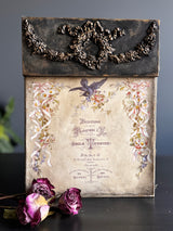 Wreath & Swags Mould by I.O.D. with vintage box, florals, French text, bird, wilted roses, and ornament mould.
