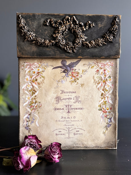 Wreath & Swags Mould by I.O.D. with vintage box, florals, French text, bird, wilted roses, and ornament mould.