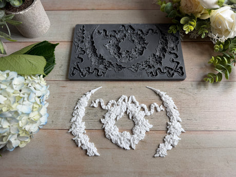 IOD Wreath & Swags Mould, ornate food-safe silicone mould for vintage decor, styled with florals.