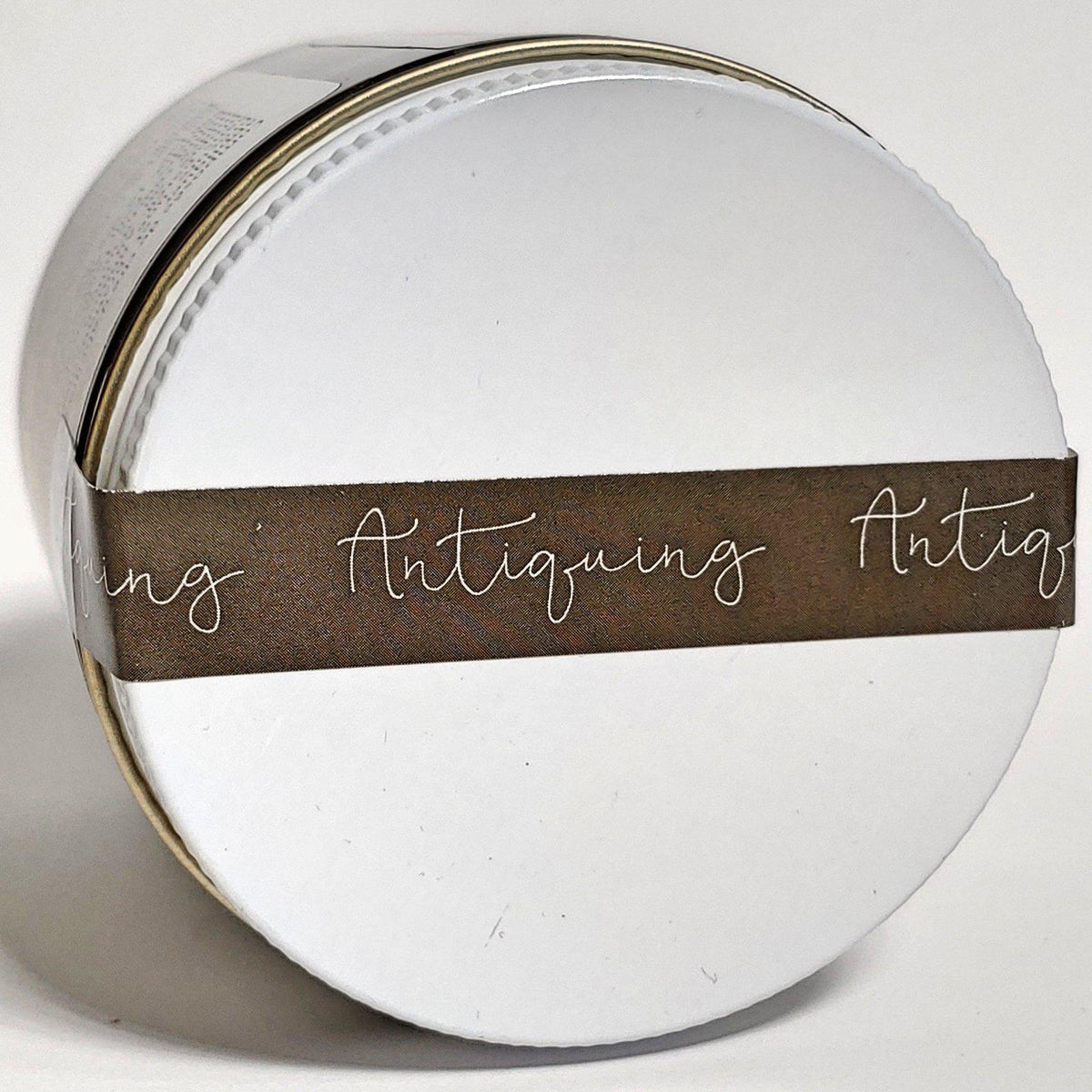 Fusion Mineral Paint Antiquing Furniture Wax by Homestead House in a round white container with a brown label.
