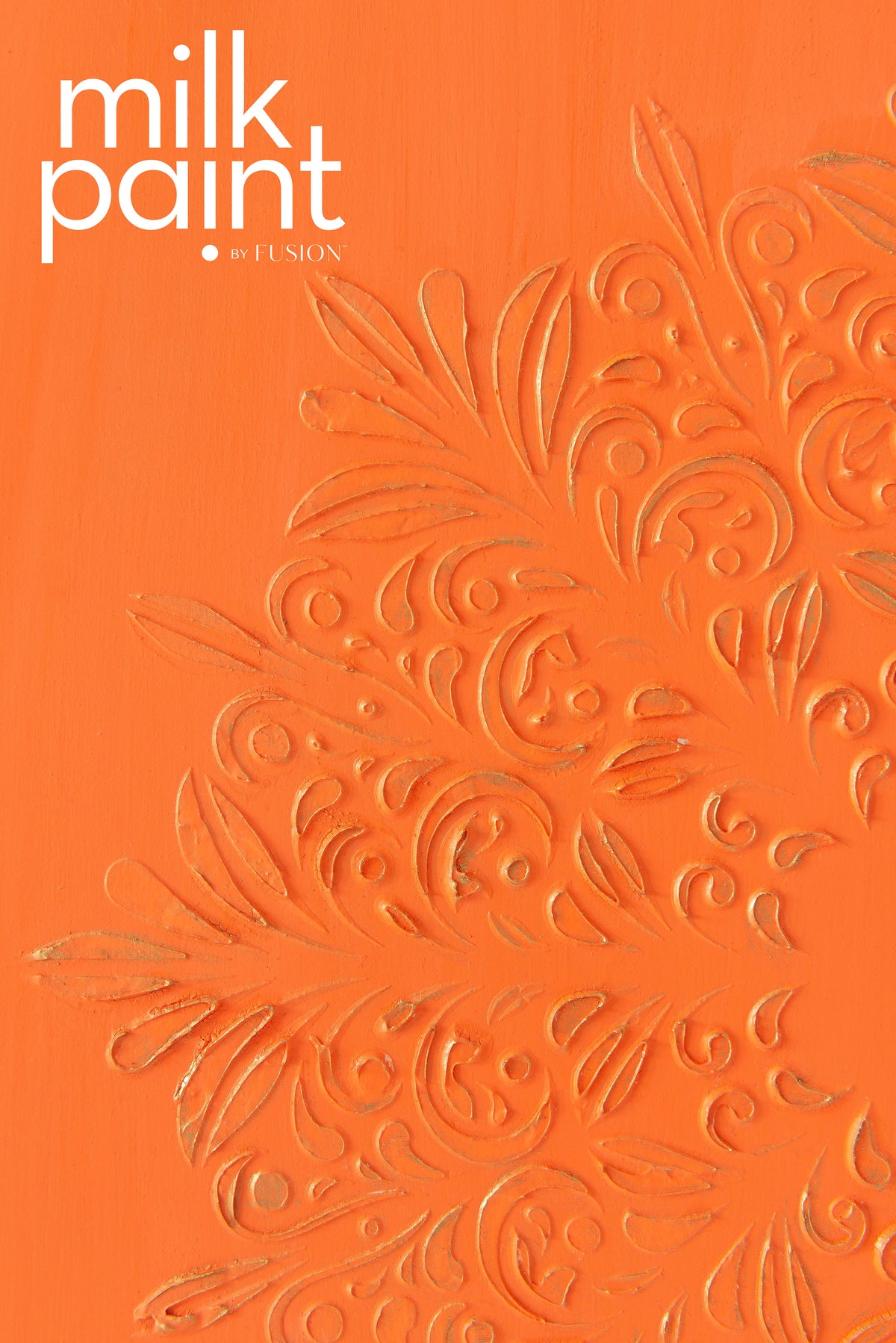 Embossed floral design on orange Aperol Spritz Milk Paint by Fusion Mineral Paint, text at top left corner.