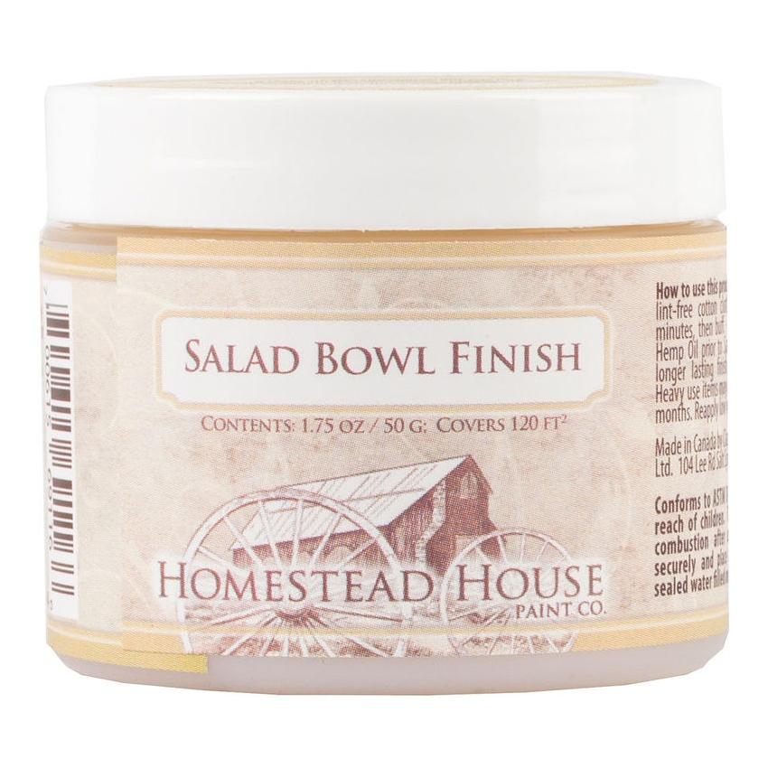 Beeswax Salad Bowl Finish by Fusion Mineral Paint in a small jar on a plain background.