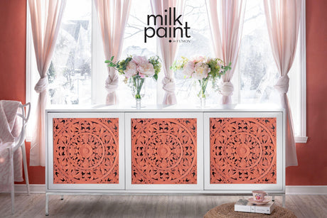White sideboard with coral carved doors in Casa Rosa Milk Paint by Fusion Mineral Paint.