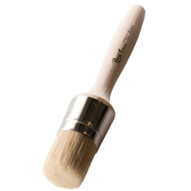 Paint Pixie Cera Wax Brush with round light wood handle and white bristles for painting and waxing projects.