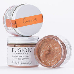 Three jars of Fusion Mineral Paint Copper Metallic Furniture Wax, one open to display copper-colored wax inside.