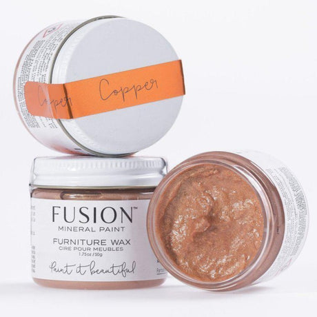 Three jars of Fusion Mineral Paint Copper Metallic Furniture Wax, one open to display copper-colored wax inside.