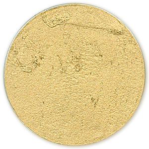 Notions Gilders Paste Wax gold, round and flat with a textured surface.