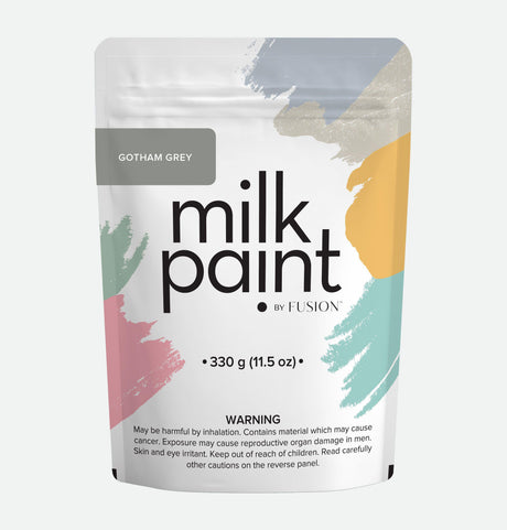 Fusion Mineral Paint Gotham Grey Milk Paint pouch, 330g, labeled with colorful brushstrokes and a warning below.