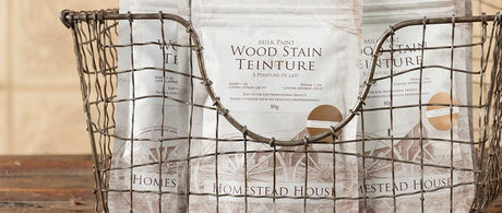 Wire basket holding three Fusion Mineral Paint Milk Paint Wood Stain bags for furniture restoration.