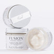 Three 1.75oz Fusion Mineral Paint jars; one is open, revealing Pearl Metallic Furniture Wax’s pearlescent finish.