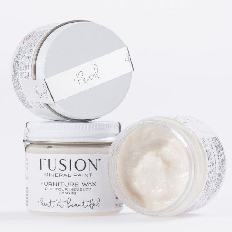 Three 1.75oz Fusion Mineral Paint jars; one is open, revealing Pearl Metallic Furniture Wax’s pearlescent finish.