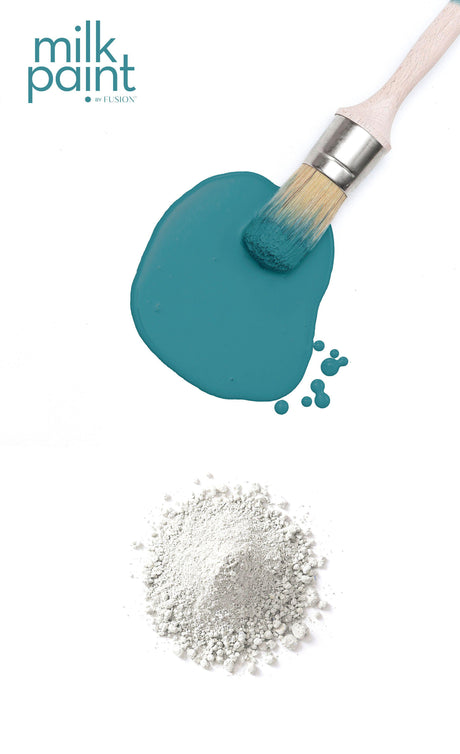 Paintbrush, Poolside Milk Paint by Fusion Mineral Paint, teal paint spill, and white Fusion Mineral Paint powder.
