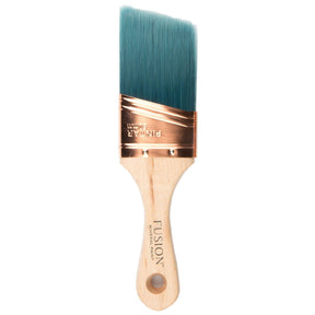 Fusion Mineral Paint Synthetic Angled Workshop Brush 2″ with wooden handle, teal bristles, and copper ferrule.